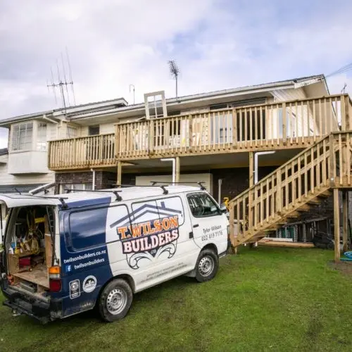 Deck construction with wooden balustrade